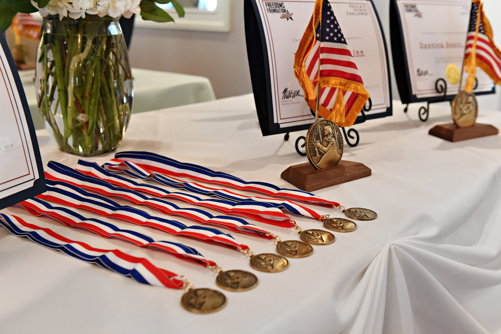 Awards table with a close up of the medals