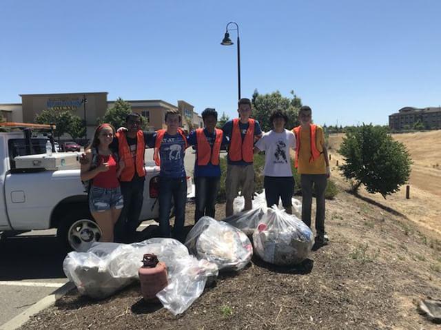 Some of the students with the garbage that they collected.